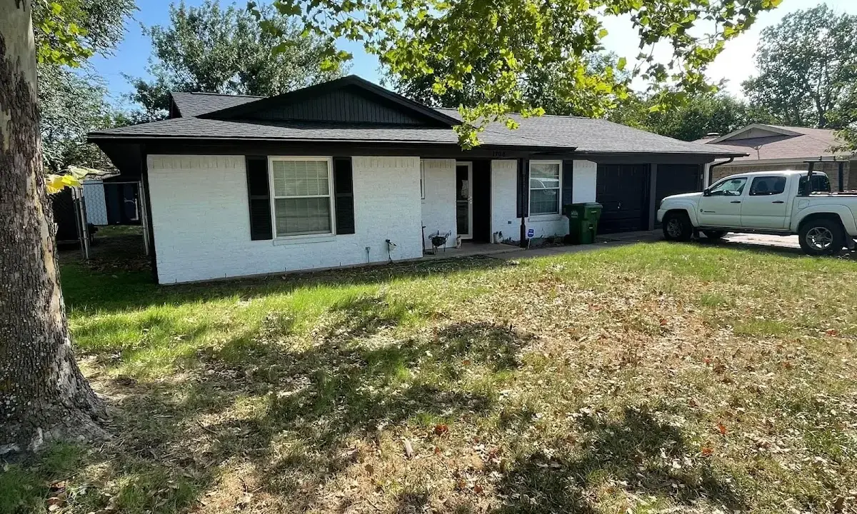Professional roofing crew working on a residential roof in Mays Chapel